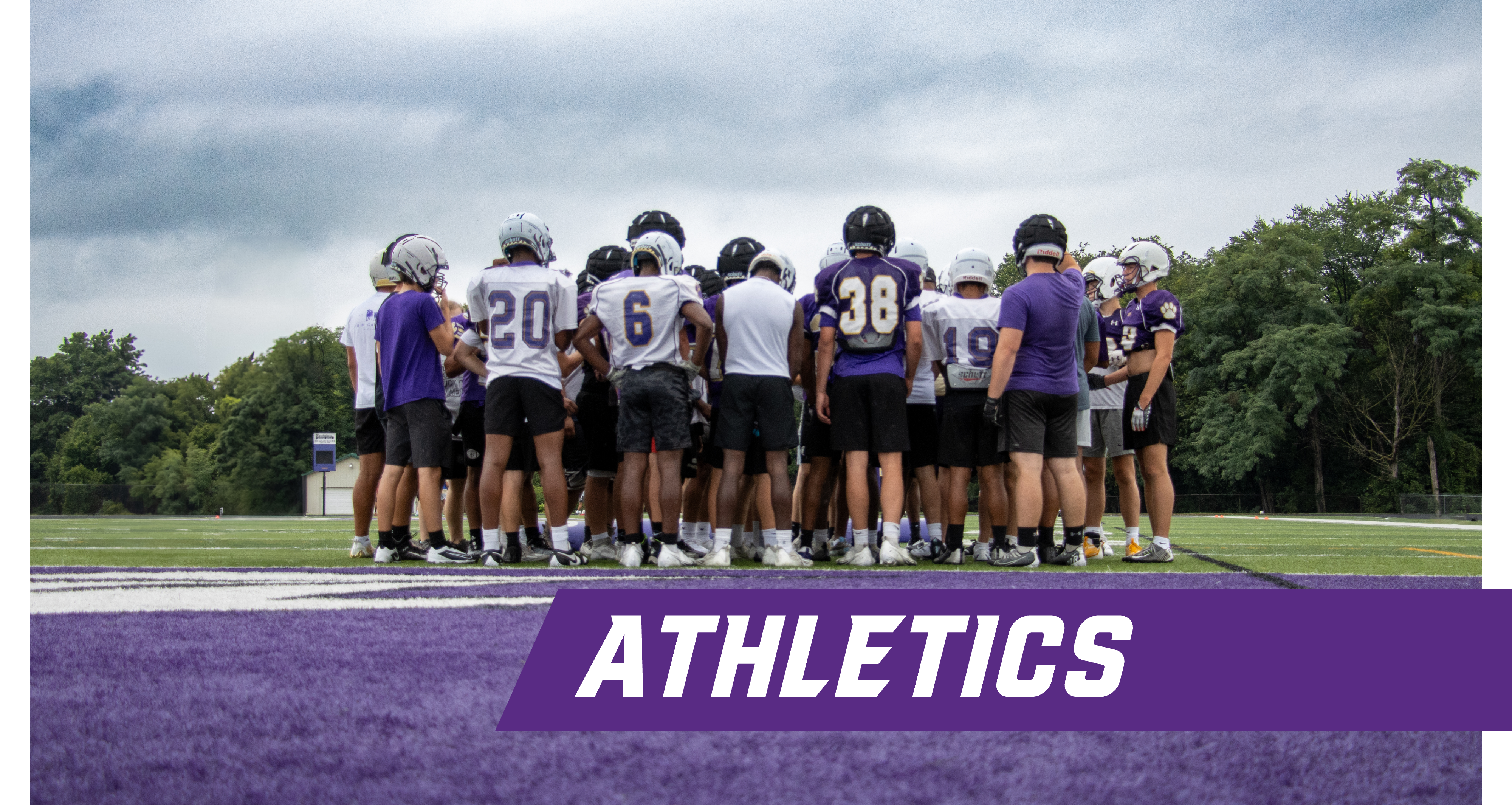 Bardstown Football Team Huddled Up With Graphic Text Saying Athletics at the bottom